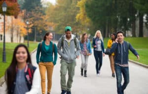 Group of students walking outdoors on campus
