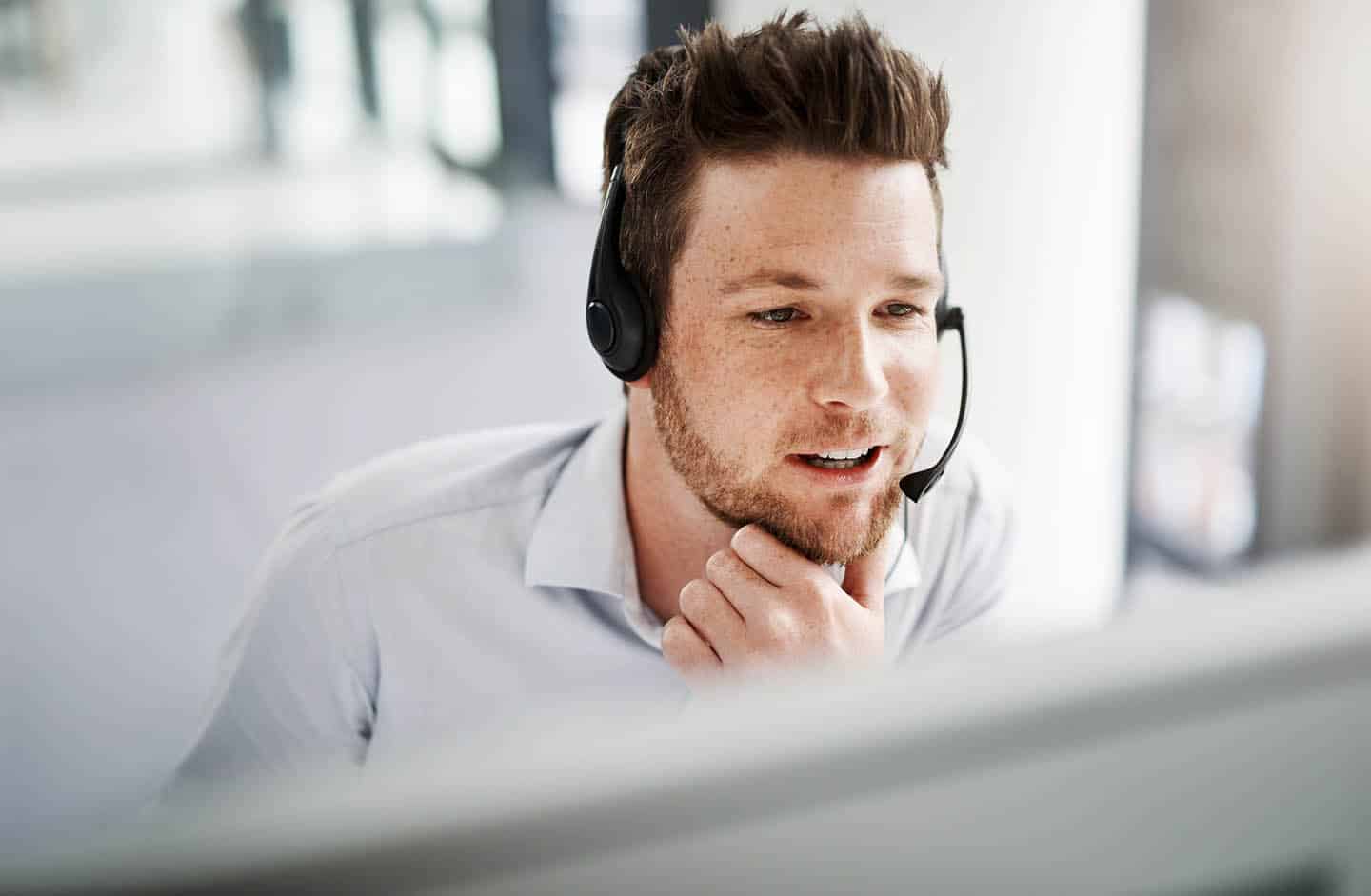 Shot of a handsome young man working in a call center