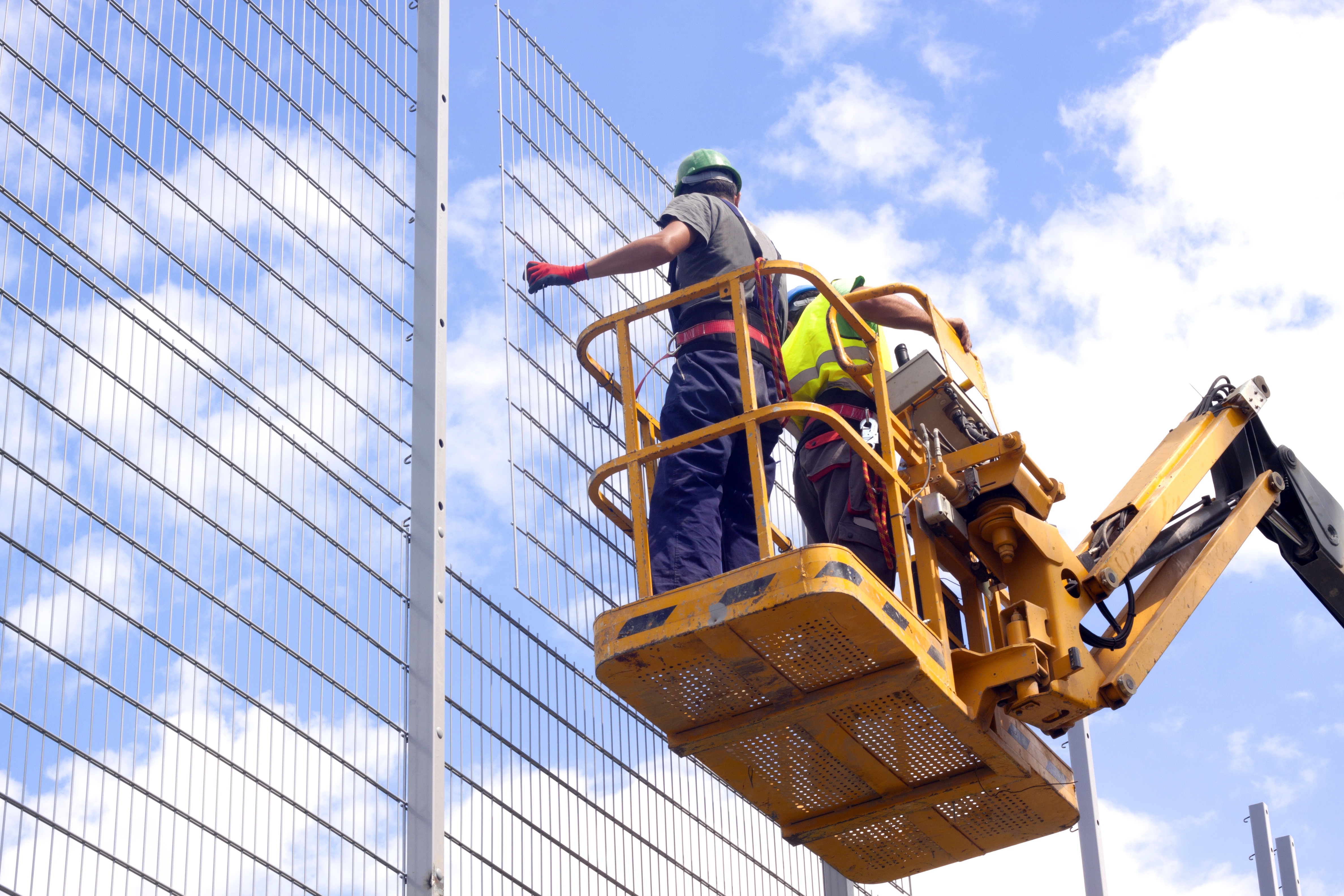 Workers in an aerial lift