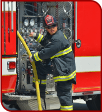 A fireman operating on a fire truck
