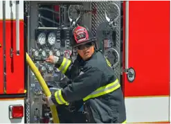 Firefighter operating a firetruck