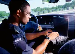 Law enforcement worker in a vehicle