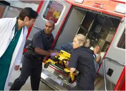 Paramedic workers and a doctor at work