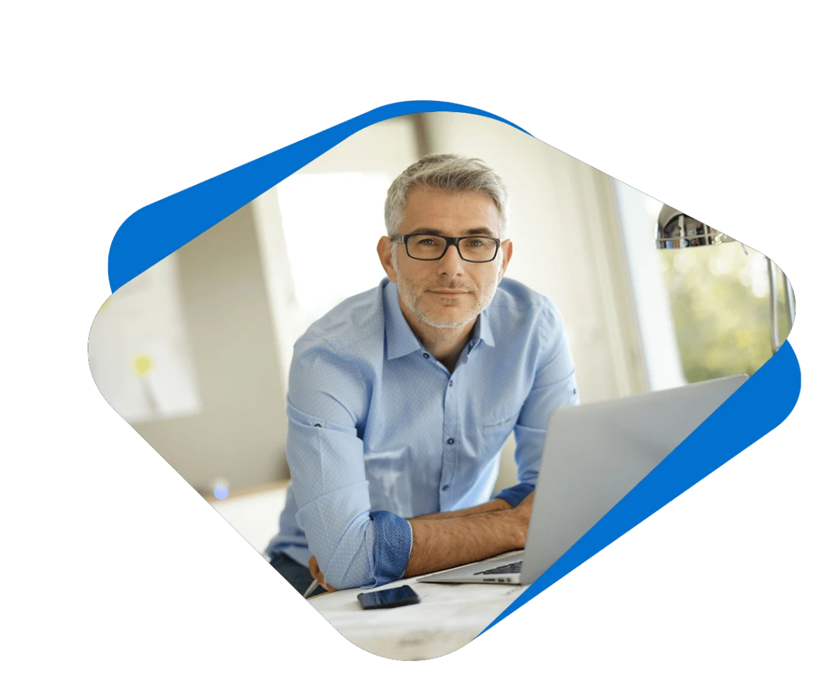 An architect at a laptop workstation