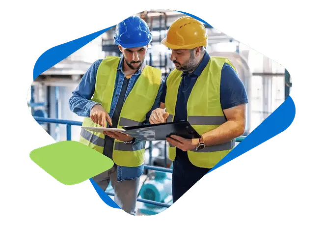 two electrical workers reviewing training documents