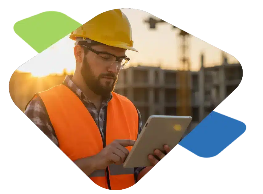 A construction work reviews training information on a tablet