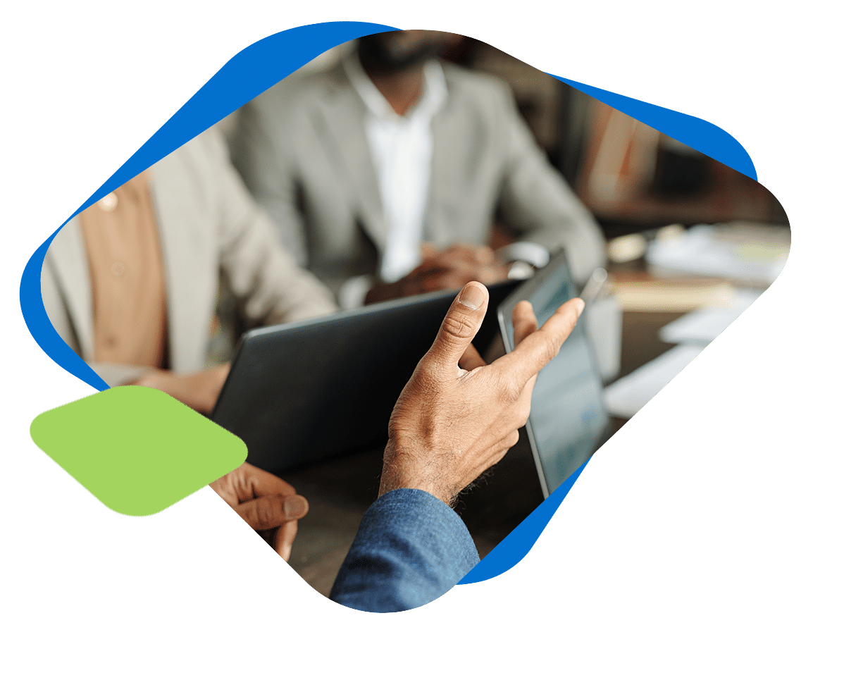 professionals collaborating around laptops