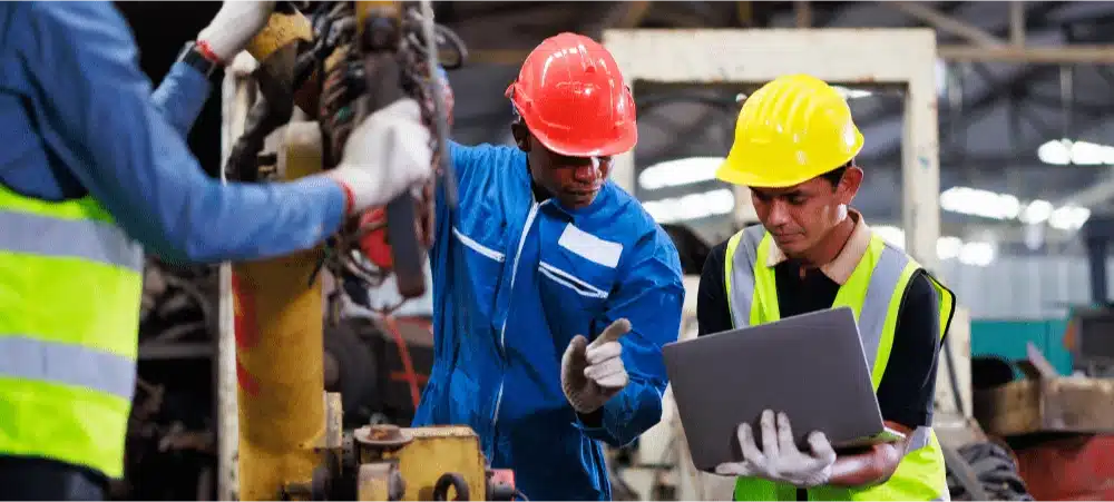 manufacturing employees training on a computer