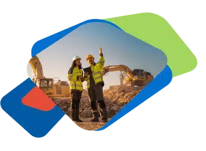 2 construction workers on a job site using construction management software