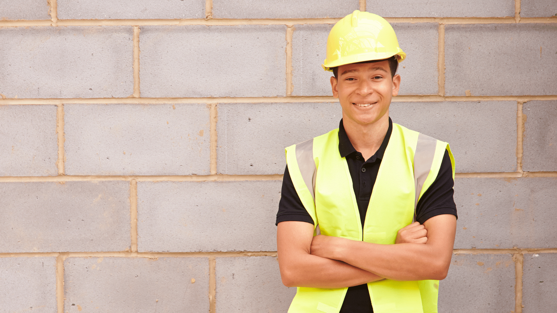 CTE student wearing PPE gear standing outside.