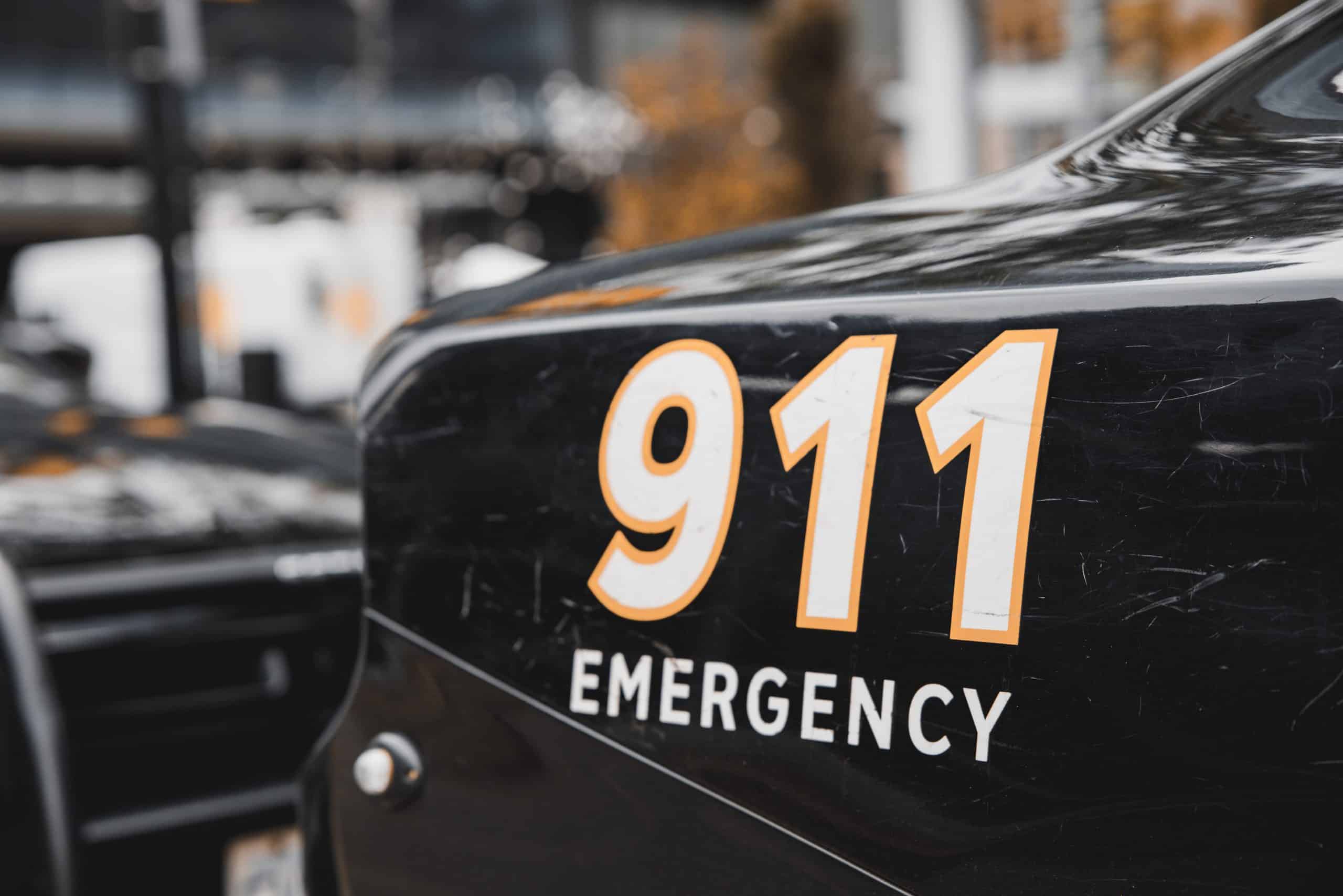 A photo of a 911 emergency sign for an emergency communication center.