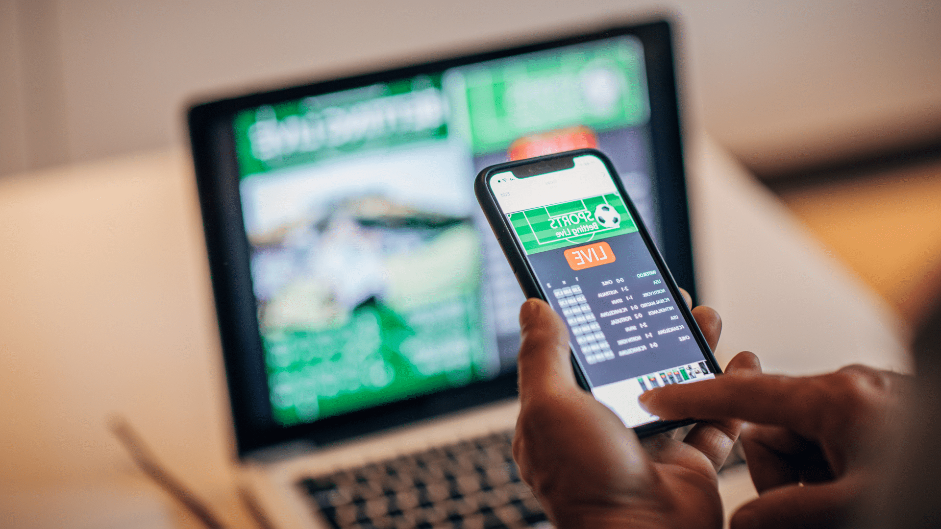 A student using a phone to conduct online sports gambling.